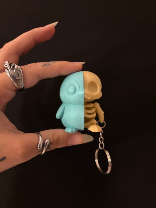Half penguin skull keychain