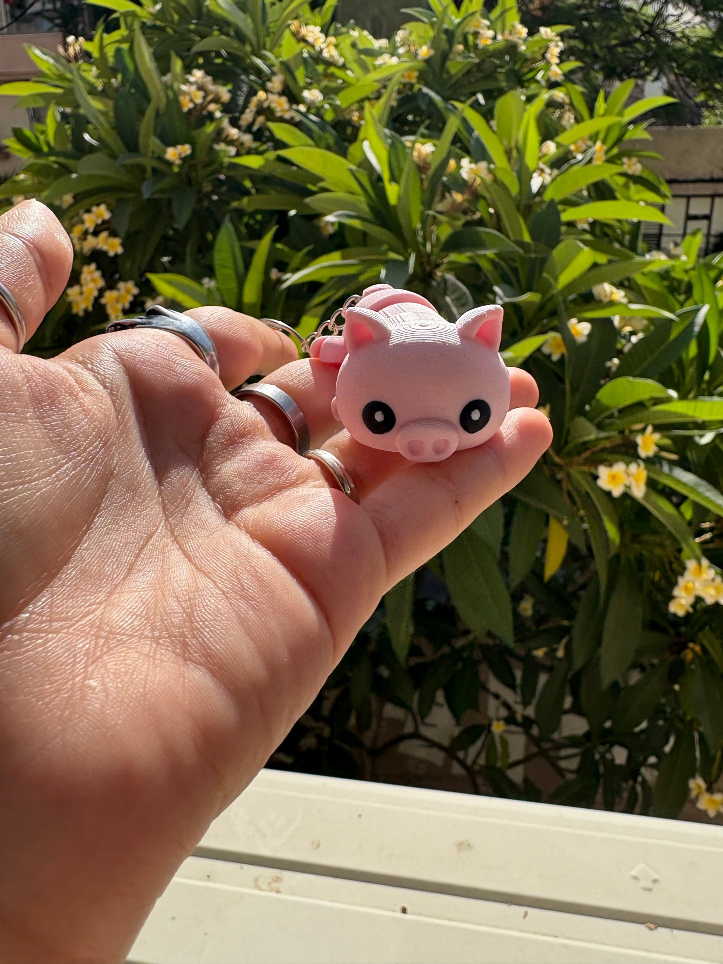 Articulated pig keychain