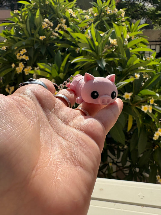 Articulated pig keychain